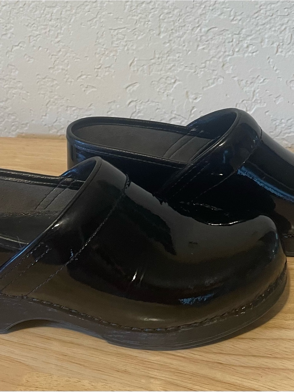 Dansko Women’s Black Patent Leather Clogs